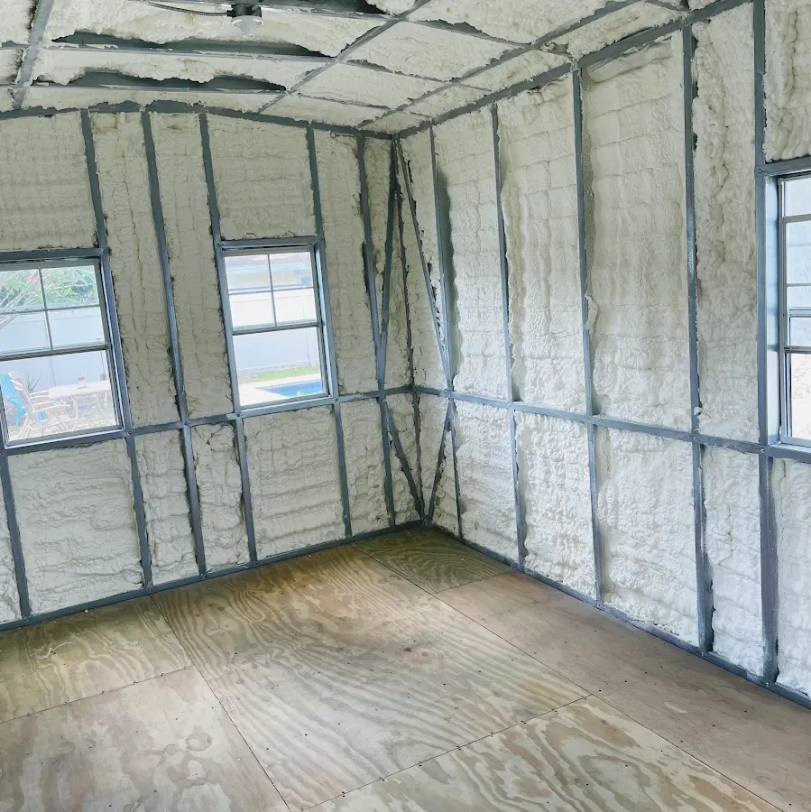 Closed-cell spray foam insulation applied to wall cavities in a residential project in De Soto
